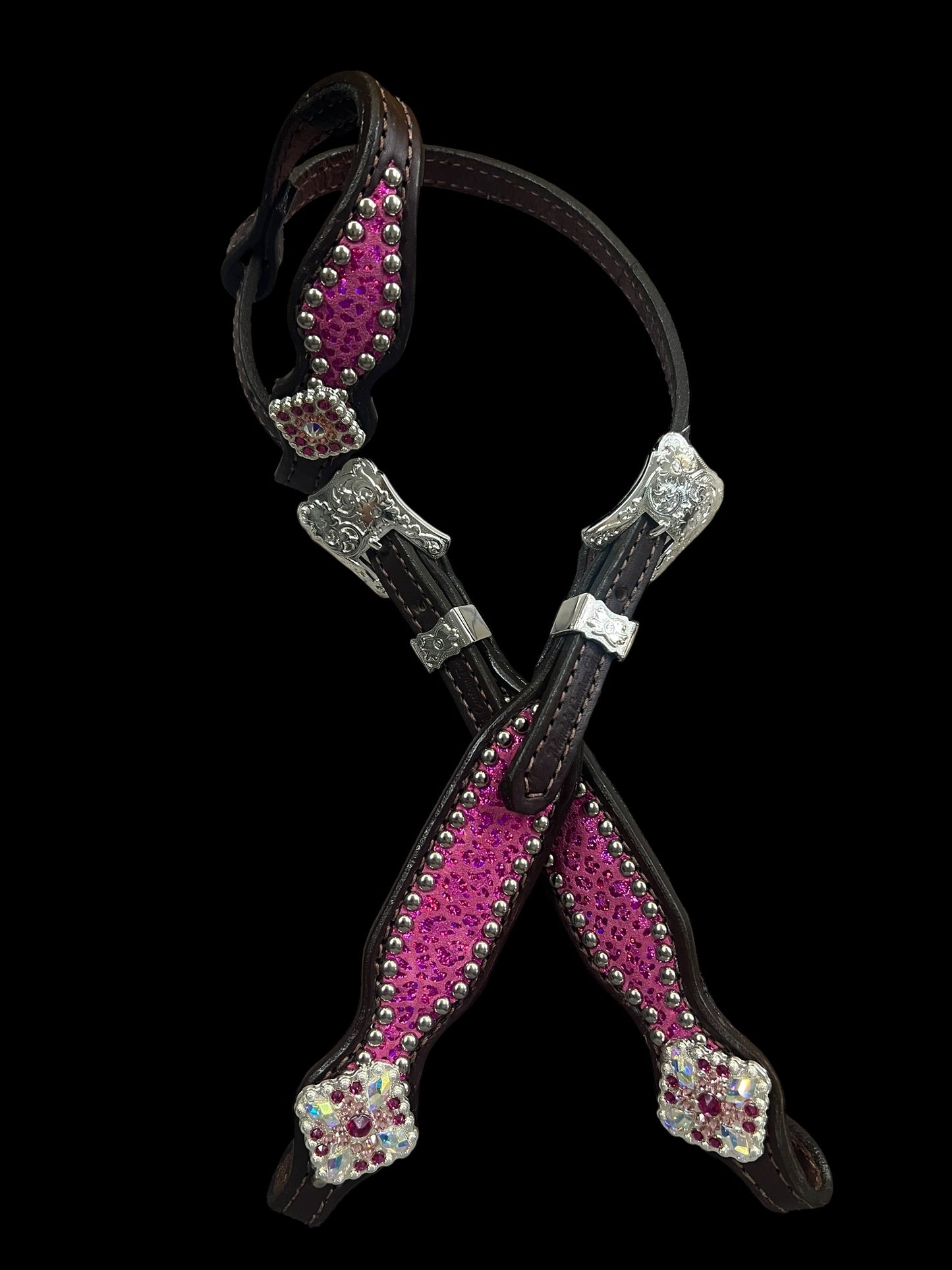 Pink leopard on dark leather