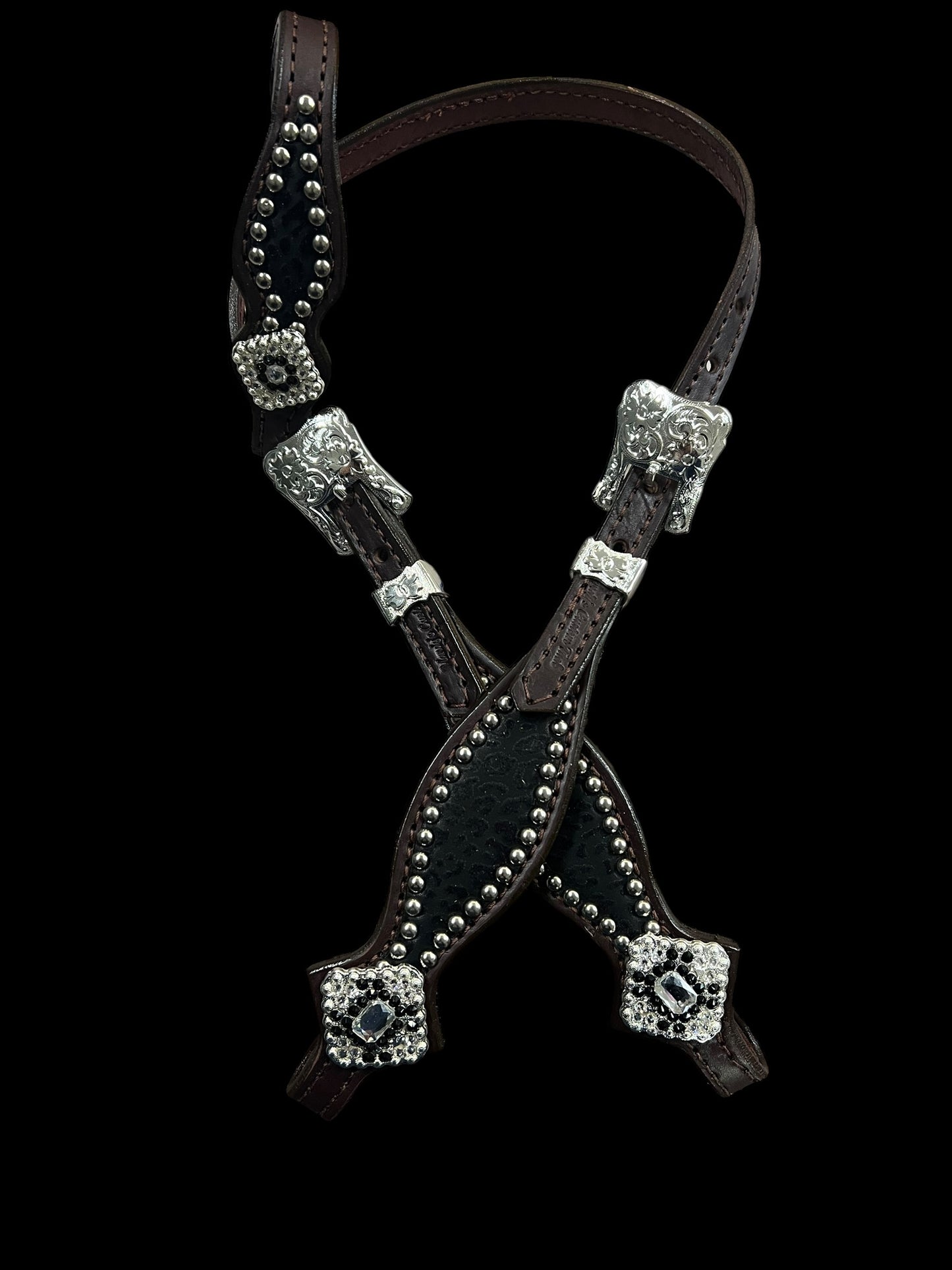 Black flocked leopard on dark leather