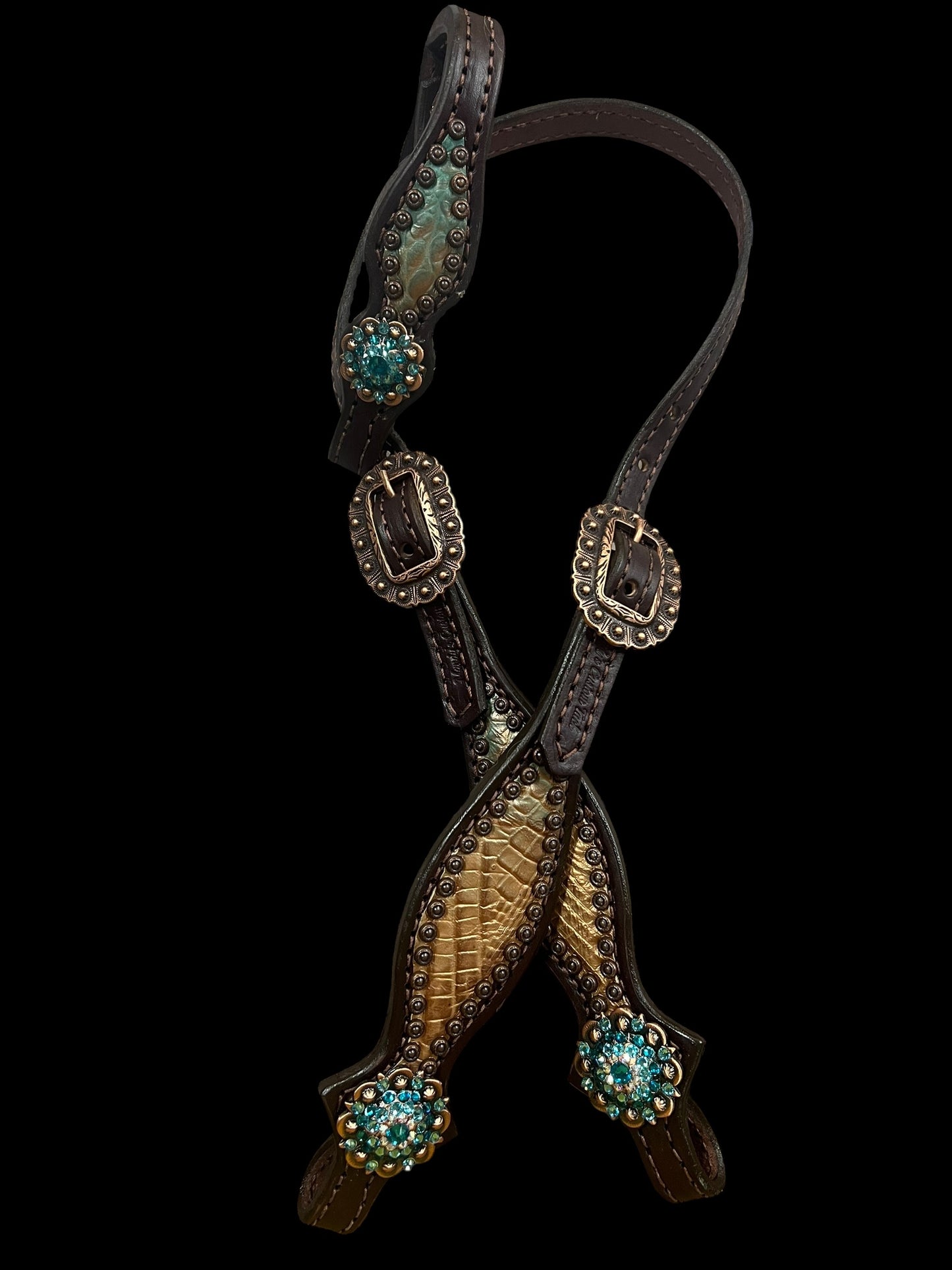 Brown and teal gator on dark leather