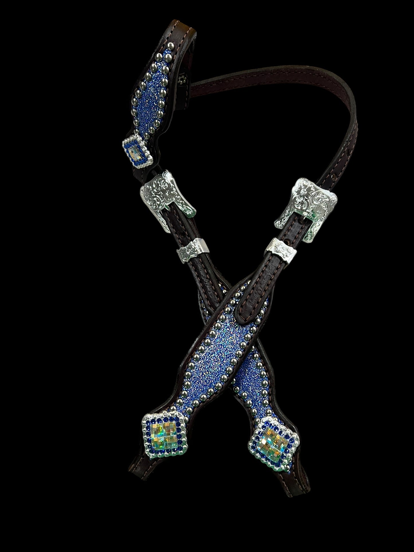 Sapphire sparkle on dark leather