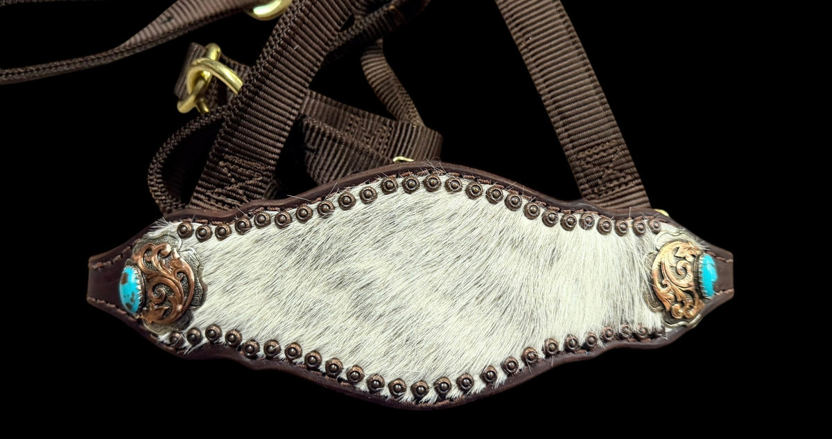 White and grey brindle cowhide on dark leather