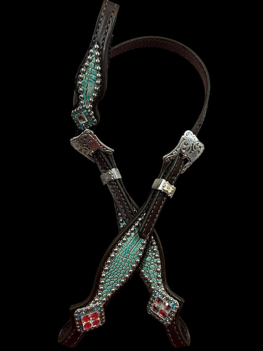 Antique turquoise gator on dark leather