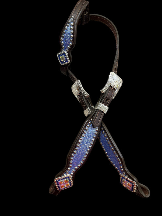Sapphire sparkle on dark leather
