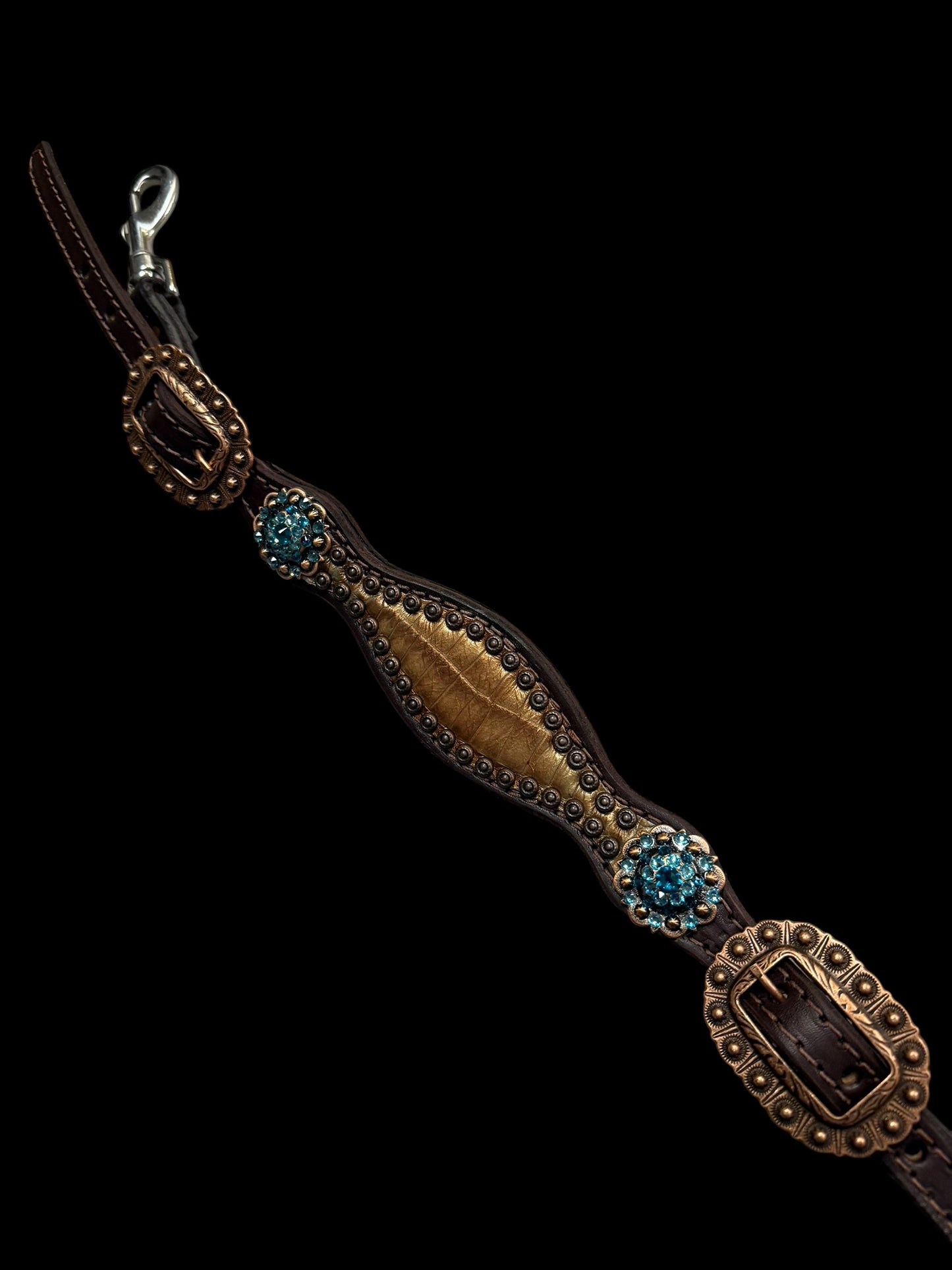 Brown and teal gator on dark leather