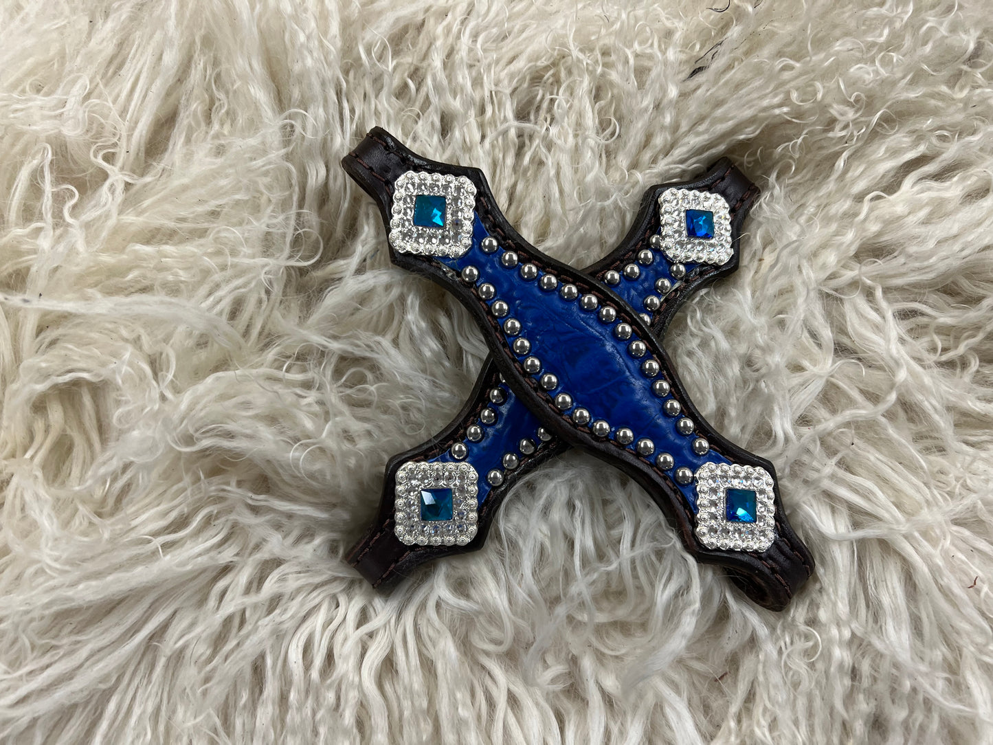 Blue gator on dark leather with blue rhinestones