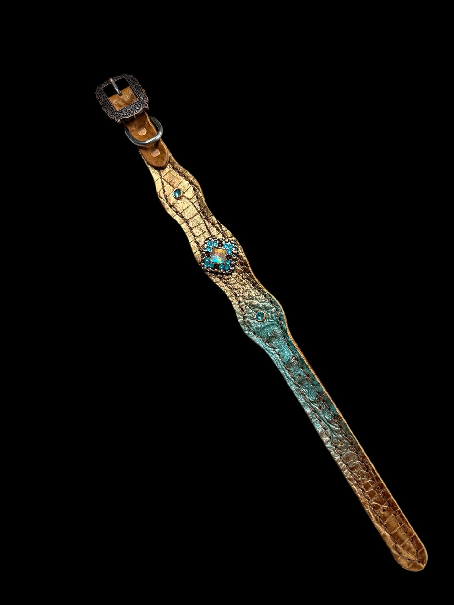 Brown and teal gator on dark leather