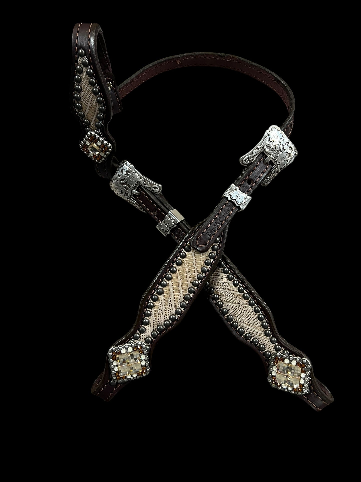 copper lizard on dark leather