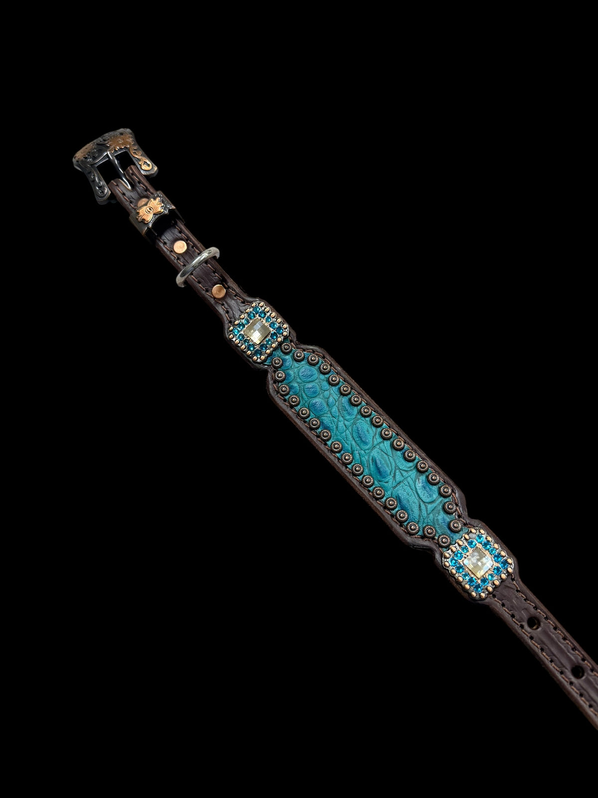 Teal gator on dark leather