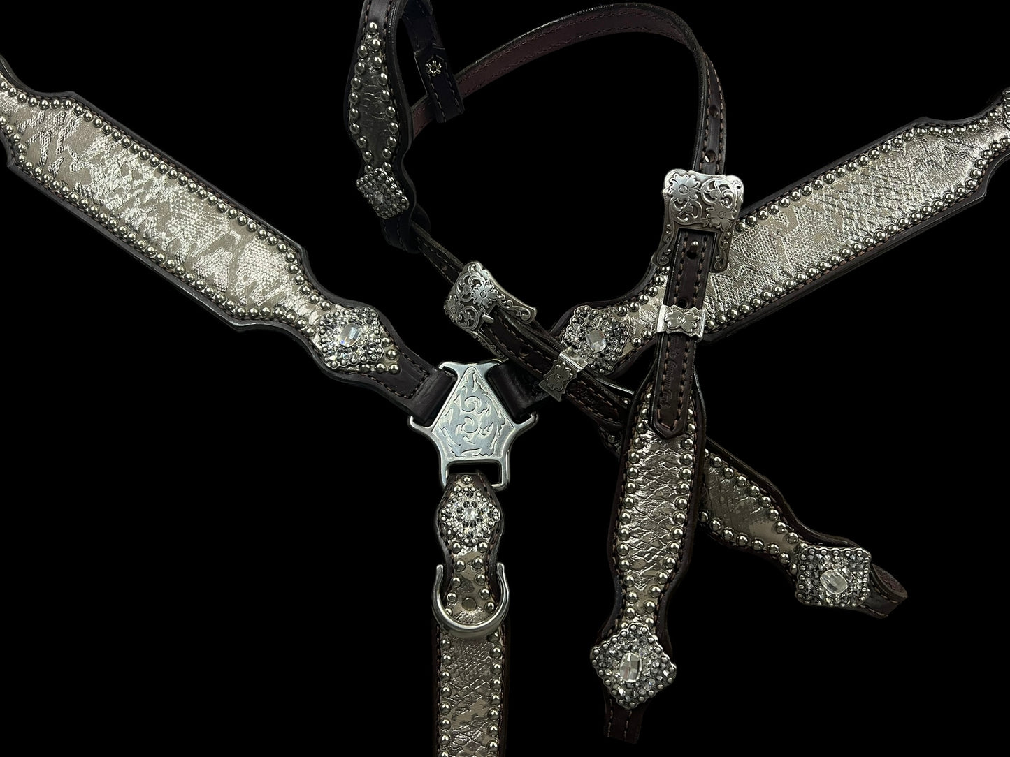 Silver snake on dark leather