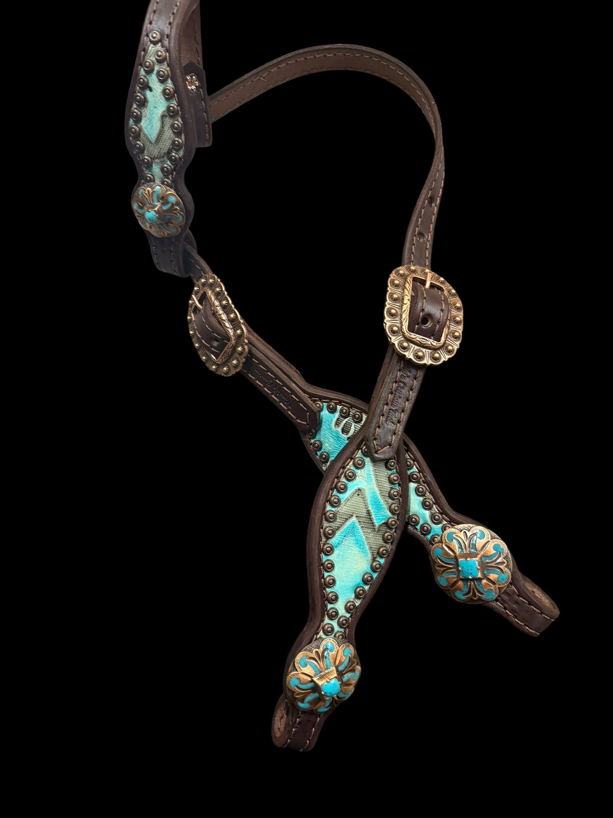 Light turquoise Laredo on dark leather