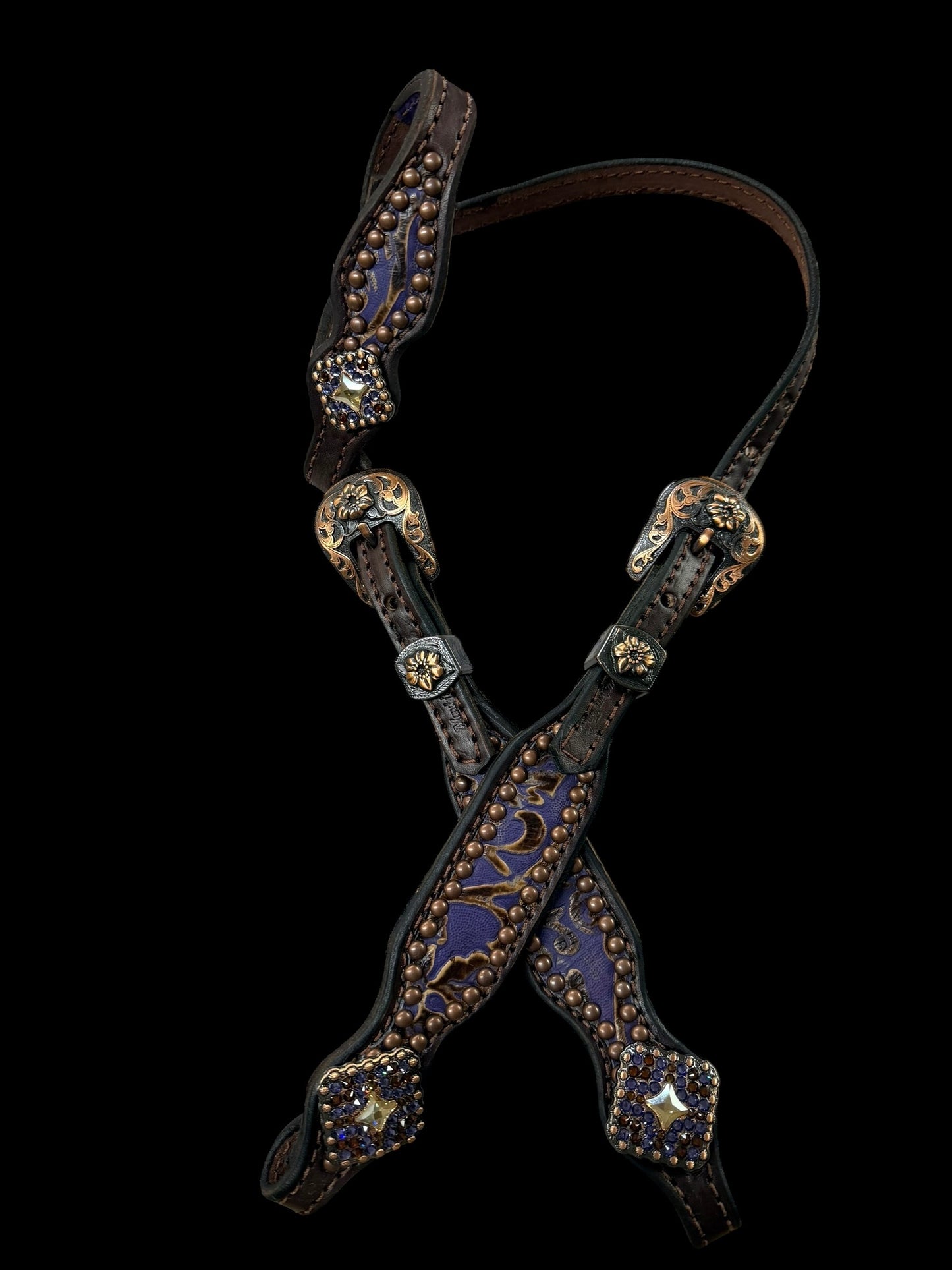 Purple and brown cowboy tool on chocolate leather
