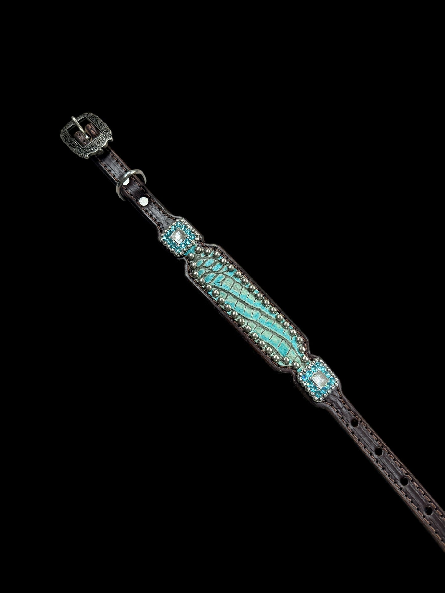 Antique turquoise gator on dark leather